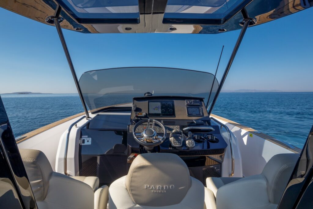 Wai cruising at sunset with golden skies reflecting on the calm waters of the Aegean Sea.