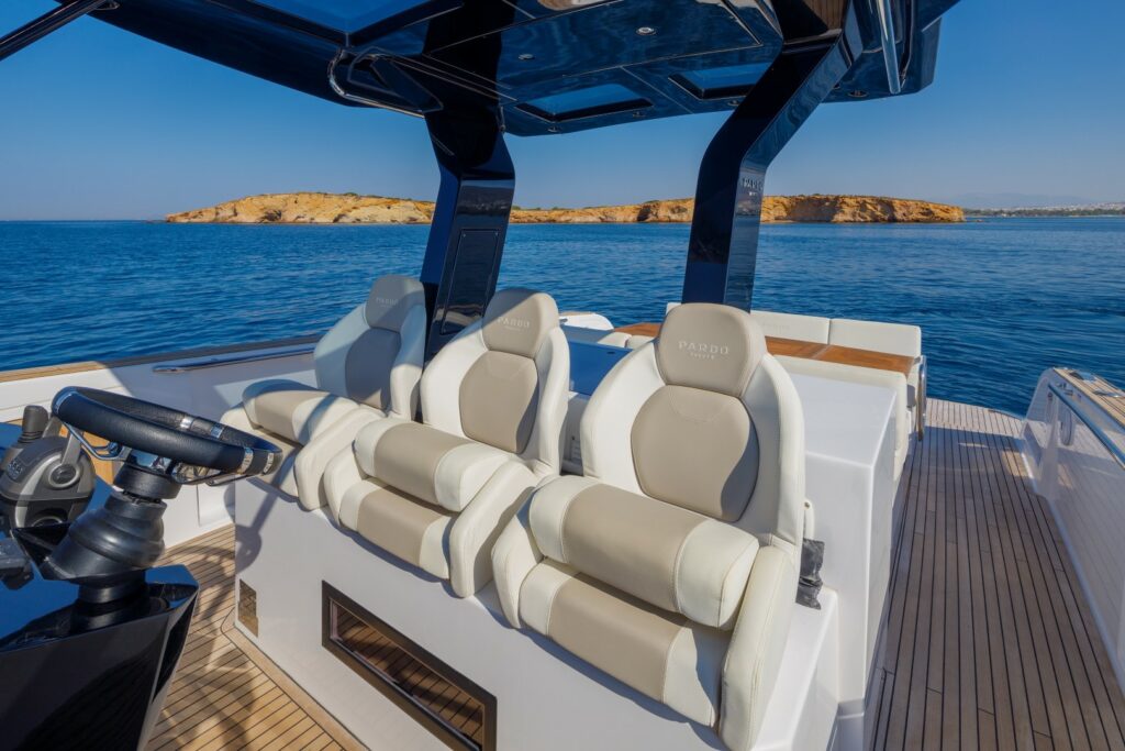 Wai cruising at sunset with golden skies reflecting on the calm waters of the Aegean Sea.