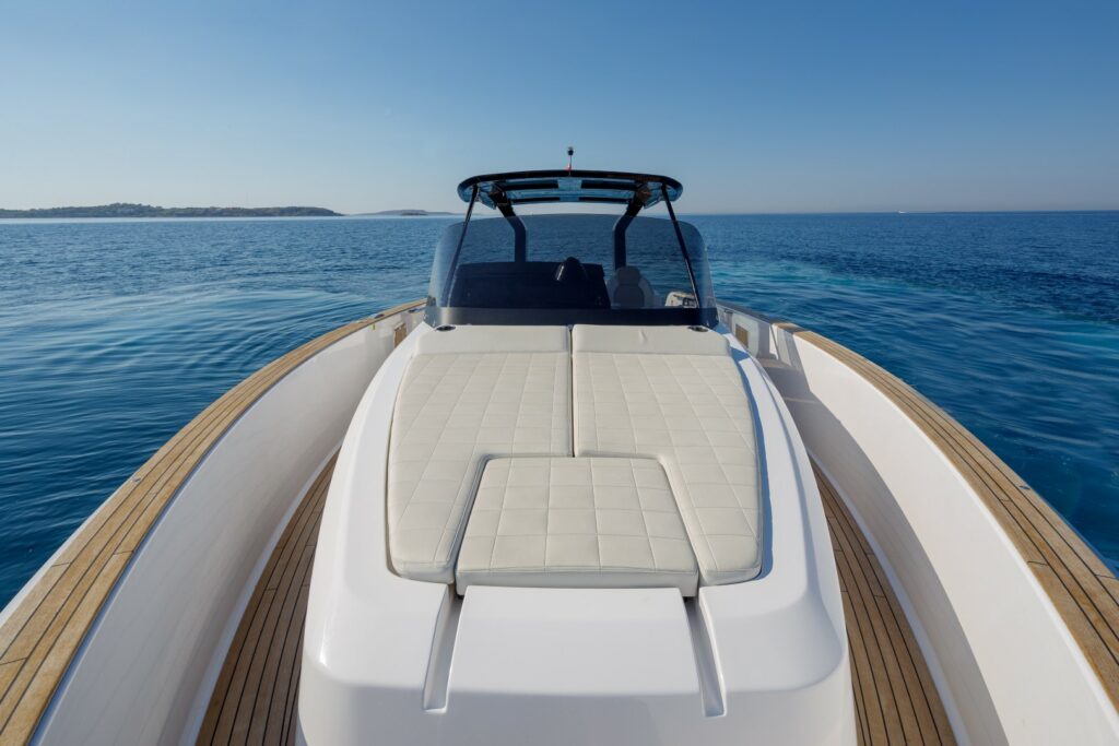 Wai cruising at sunset with golden skies reflecting on the calm waters of the Aegean Sea.