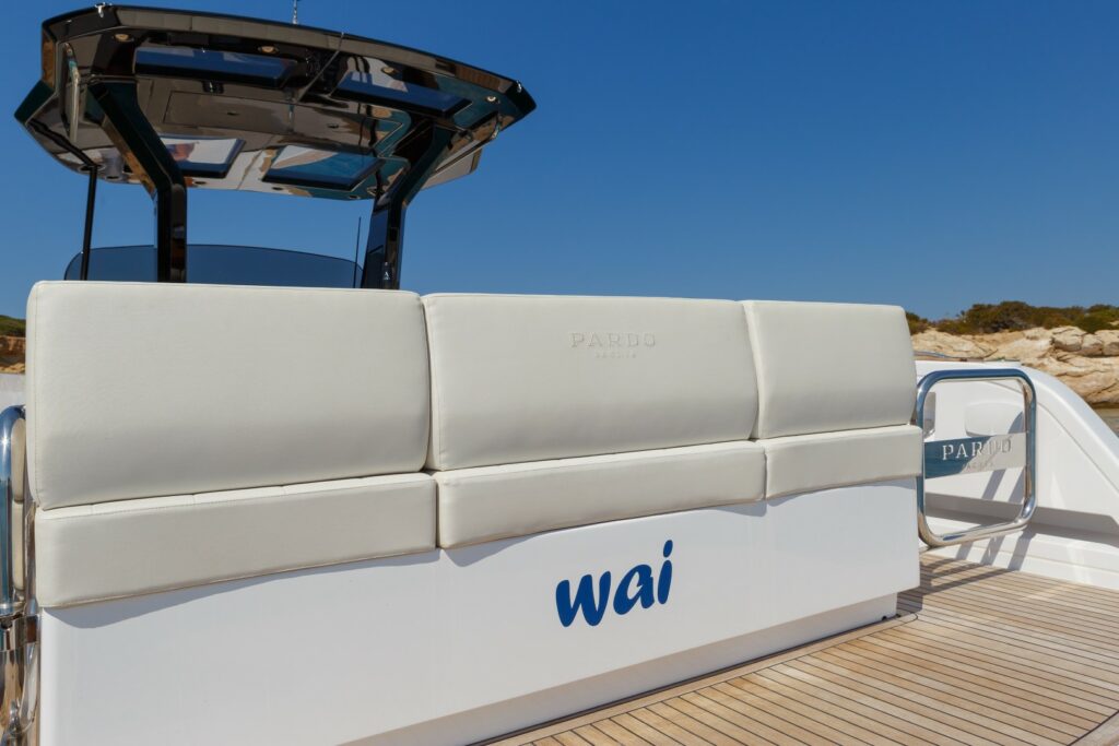 Wai cruising at sunset with golden skies reflecting on the calm waters of the Aegean Sea.