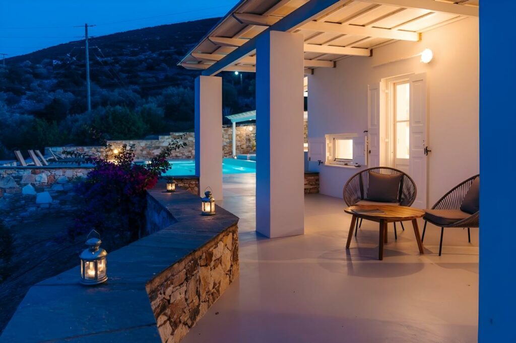 Top 5 Luxury Villas in Sifnos for 2026: Ultimate Guide to Private Island Living in the Cyclades Private villa in Sifnos at twilight — Villa Olivia Clara terrace with lanterns, bougainvillea, and illuminated pool overlooking the Cycladic landscape