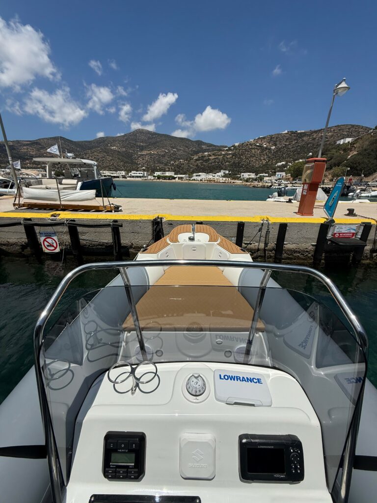 A La Mer Azur — boat rental in Sifnos, helm dashboard with Lowrance navigation and Suzuki controls