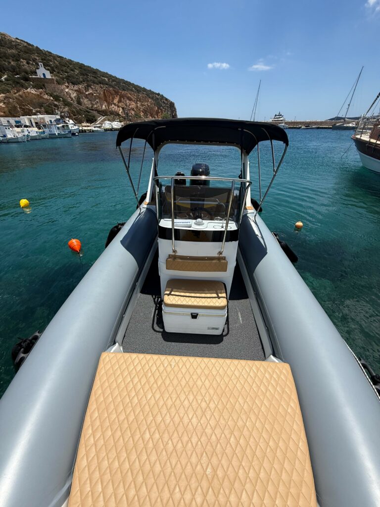 A La Mer Azur — boat for rent in Sifnos, centre console and helm in a scenic island harbour